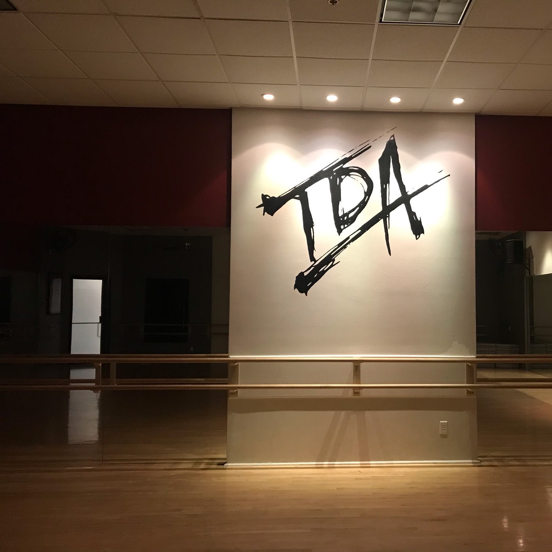 large TDA initials painted on a wall